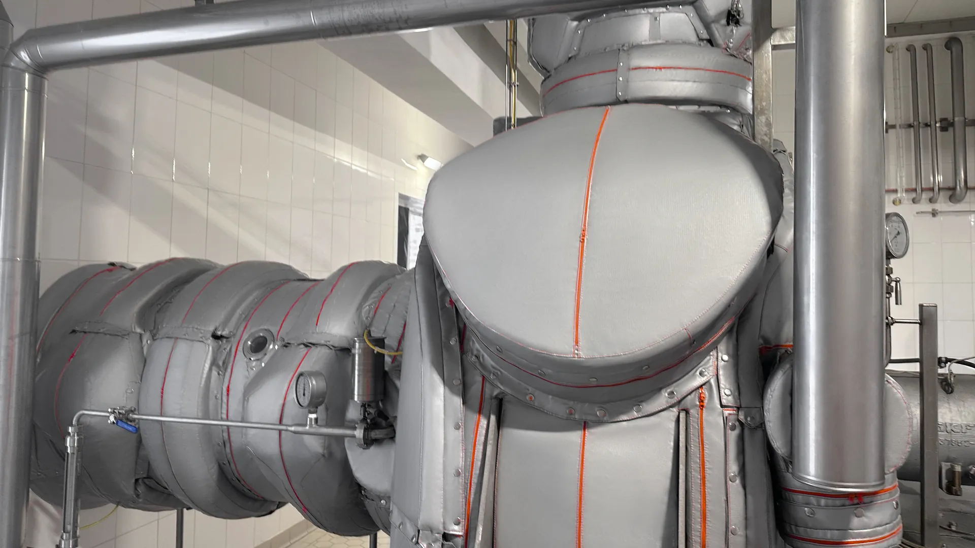 Insulated MVR fan casing and suction duct with Inzonex Modular Insulation sections and red seams